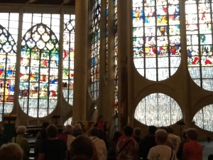 Inside L'Eglise Jeanne d'Arc with the stained glass windows.